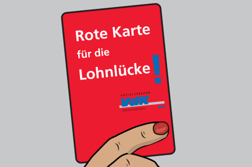 Rote Karte mit der Aufschrift: "Rote Karte f&uuml;r die Lohnl&uuml;cke!".